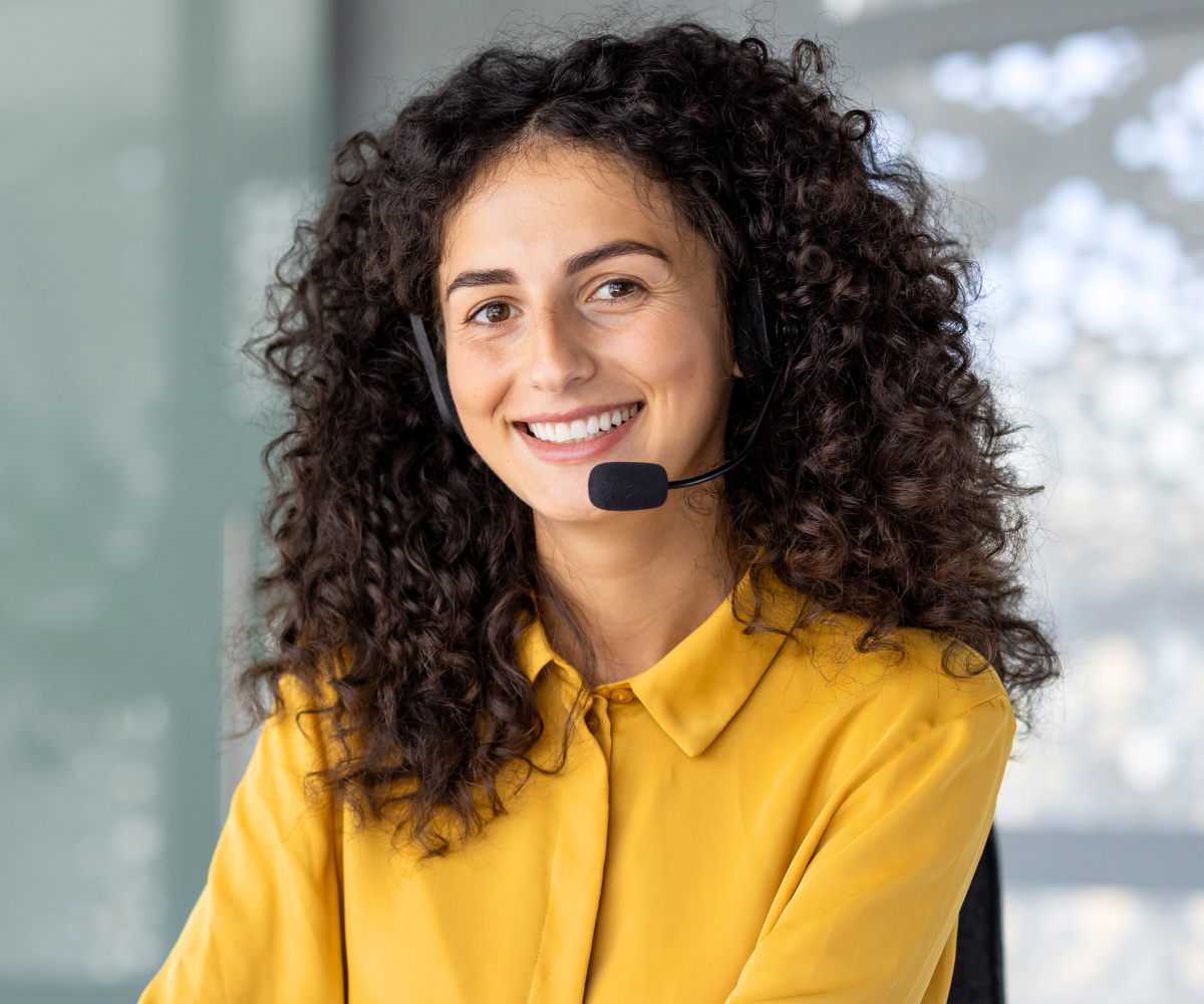 smiling receptionist ready to answer your orthodontic questions contact us today