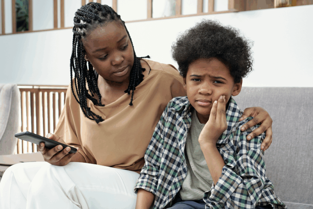 mom with son in pain from a broken dental appliance calling her emergency orthodontist in the bay area