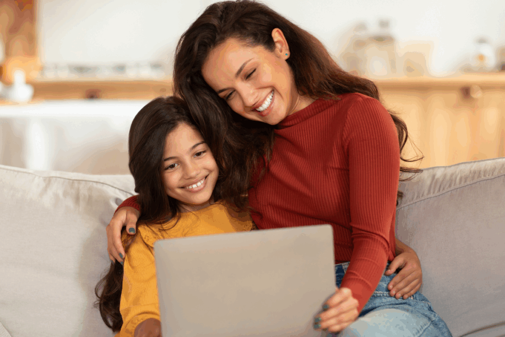 mom and daughter going over the patient forms at aubrey barrett orthodontics