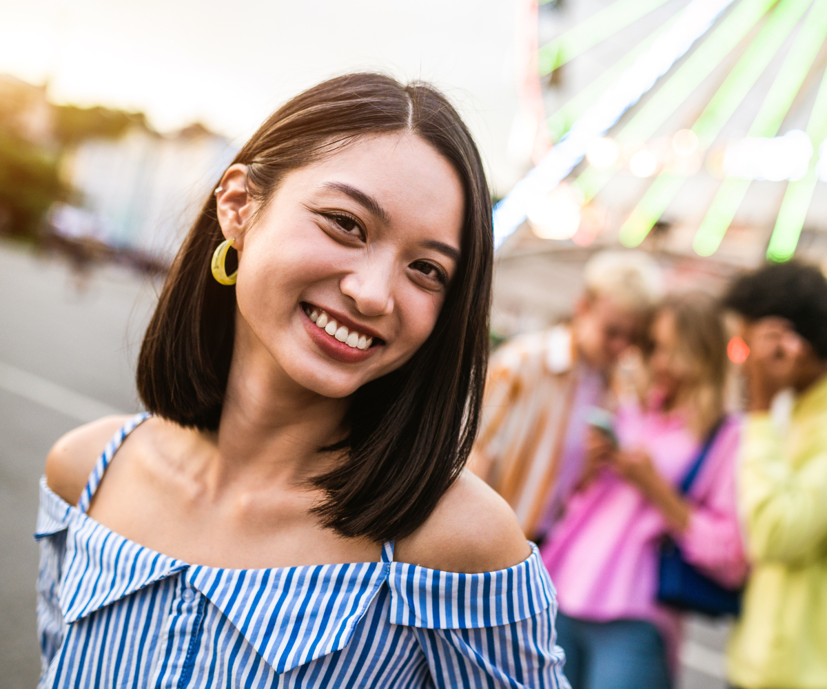 beautiful woman showing off her teeth during invisalign treatment