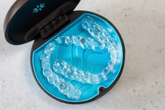 clear dental retainers in a plastic case to keep them safe
