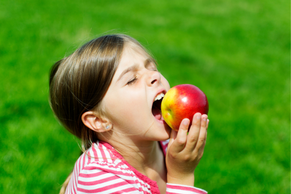 trouble biting an apple may mean your teen needs braces