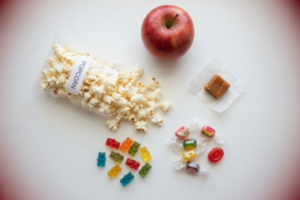foods that you should avoid if you have braces like whole apples, popcorn, sticky candy, and nuts.
